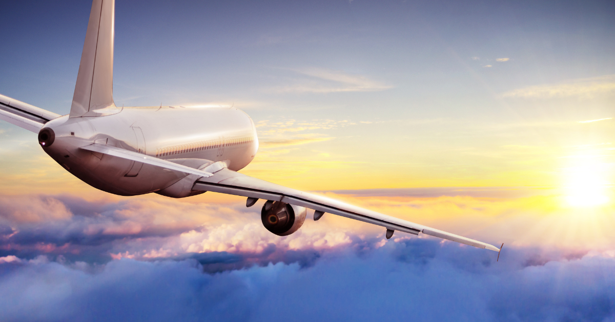 A commercial jet in flight above a layer of clouds at sunset, the aircraft least guaranteed detail in any Orbitz Airline Tickets Expedia Travelocity Expedia itinerary