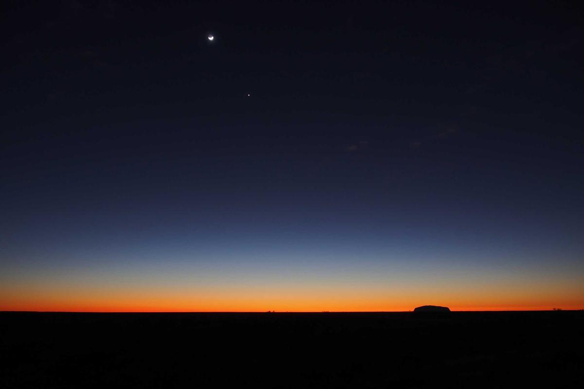 Single Trip Student Travel Insurance horizon view of a desert sunset under a crescent moon