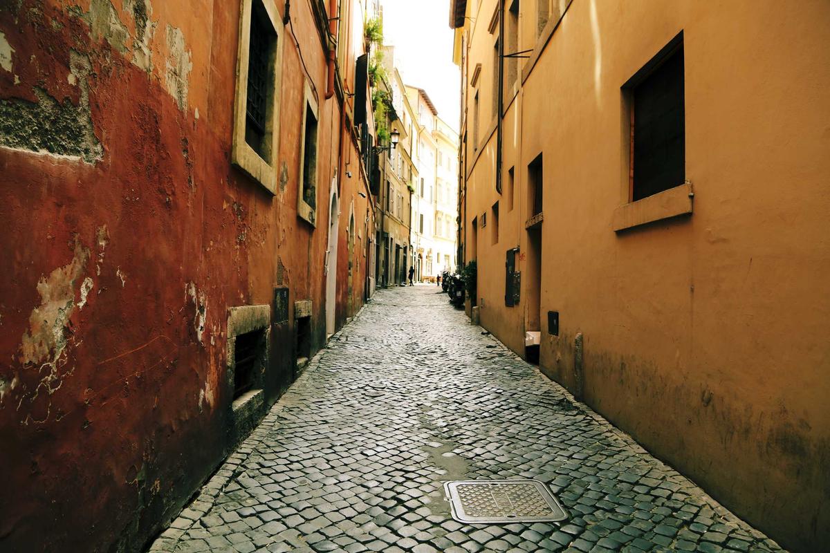 Smart Cover Travel Insurance European city break scene showing a cobblestone alleyway