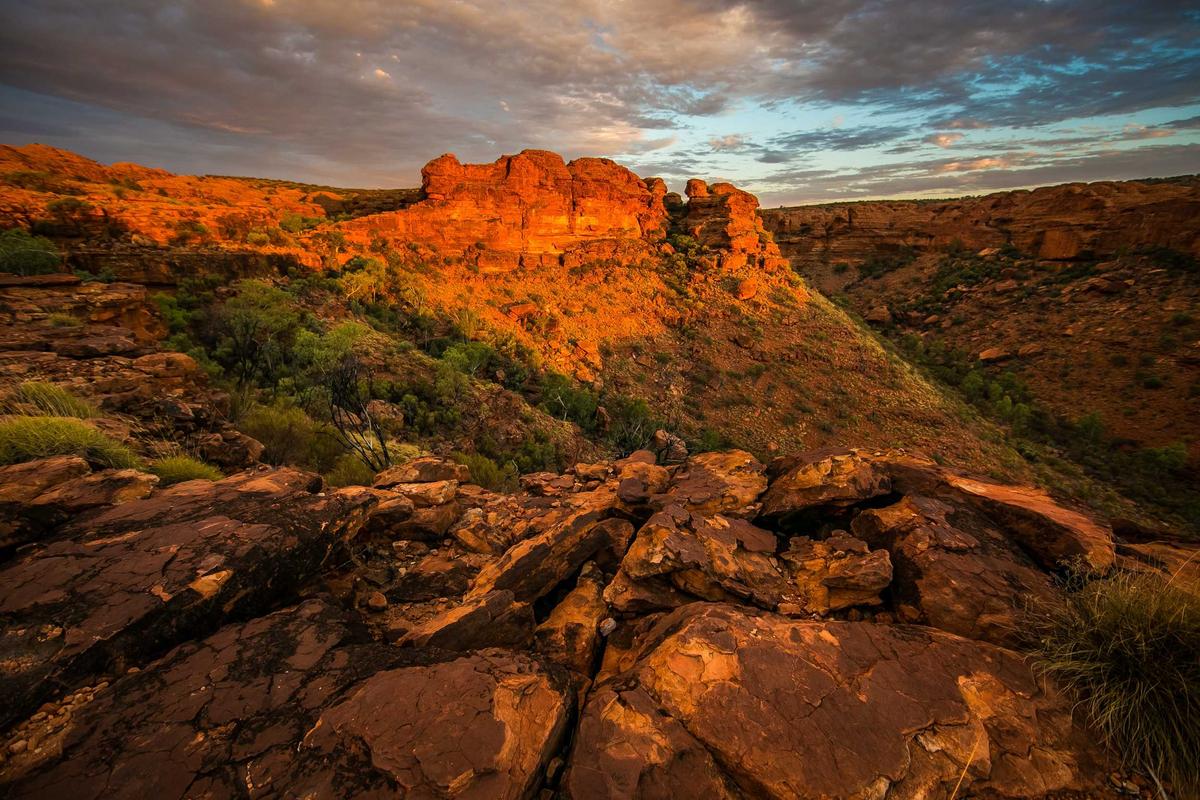 Smart Cover Travel Insurance road trip scenery with red sandstone canyon cliffs at sunset