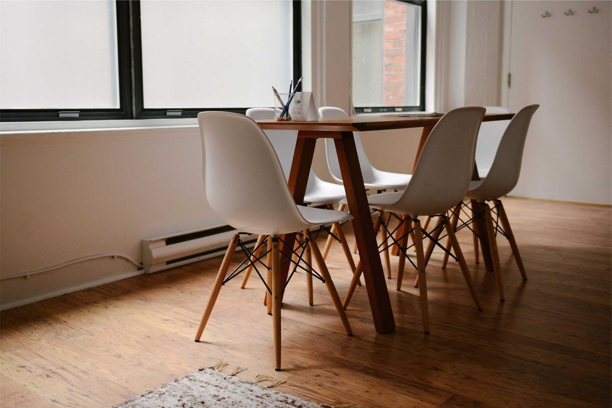 Bright meeting table and chairs in a modern apartment - Business Travel Accommodation